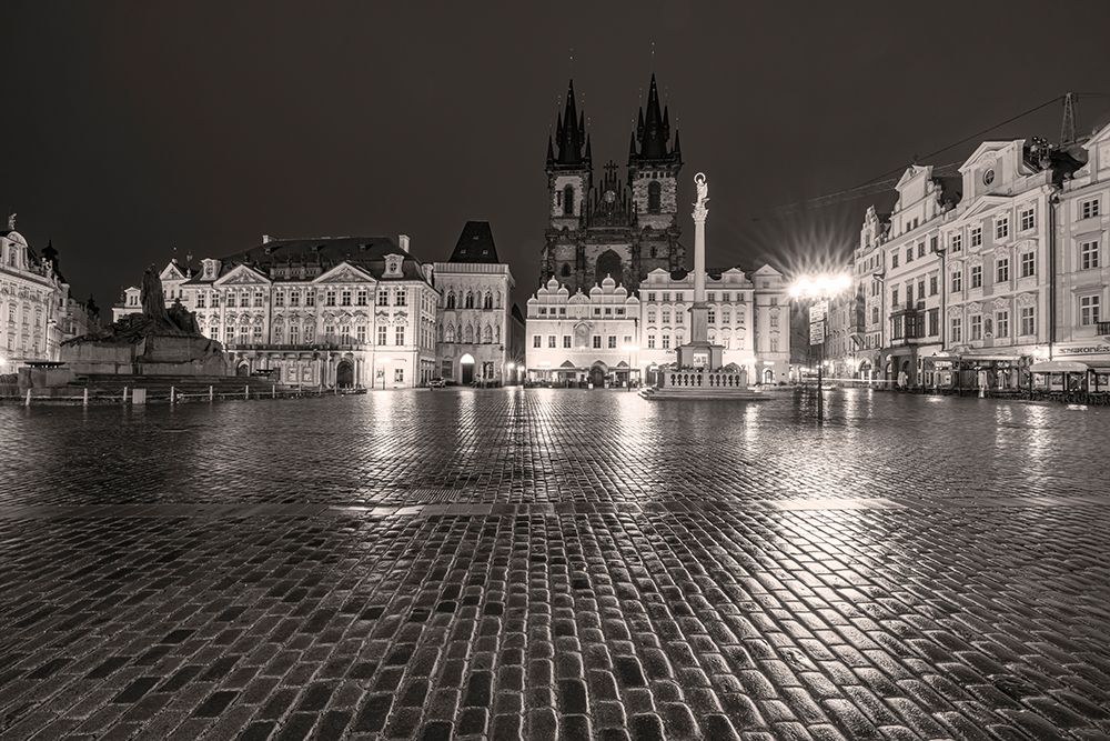 Tyn Church at dawn on wet cobblestones in Old Town Square in Prague-Czech Republic